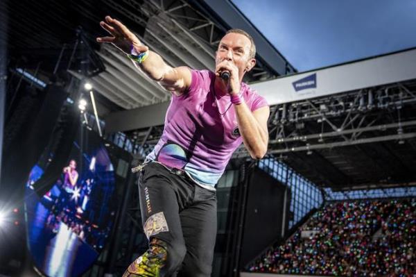 British singer Chris Martin of British band Coldplay performs at Parken Stadium in Copenhagen, Denmark, Wednesday July 5, 2023. The co<em></em>ncert is part of the Music of the Spheres World Tour. (Mads Claus Rasmussen/Ritzau Scanpix via AP)