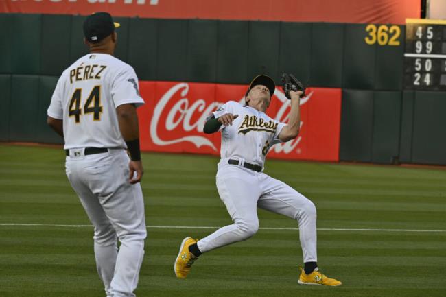 A’s second ba<em></em>seman Zack Gelof catches the ball for the third out in the second inning against the Kansas City Royals in Oakland, Aug. 22, 2023. (Nic Coury / ASSOCIATED PRESS)