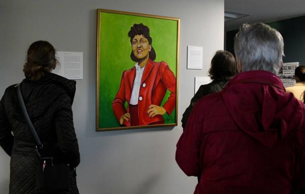 A painting of Henrietta Lacks hangs in the entryway of the Henrietta Lacks Community Center at Lyon Homes in Turner Station. Henrietta Lacks and her family lived in the community. Lacks was being treated for cancer at Johns Hopkins Hospital in 1951 when her cells were collected without her knowledge. The cells, which became known as the HeLa cell line, co<em></em>ntinue to reproduce and are still used by researchers.