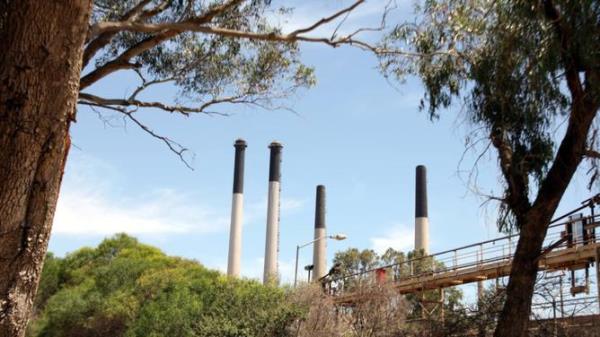 Smoke stacks at Alcoa<em></em>'s Kwinana alumina refinery in WA.