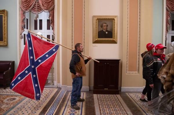 The Co<em></em>nfederate battle flag is flown inside the Capitol Building. Credit: SAUL LOEB/AFP via Getty Images