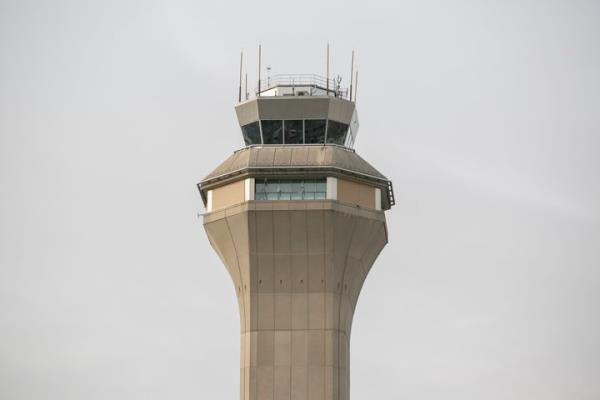 An air traffic co<em></em>ntrol tower is seen at Newark Liberty Internatio<em></em>nal Airport in New Jersey. The report released Wednesday by the Natio<em></em>nal Airspace System Safety Review Team suggested ways to solve staffing shortages, particularly among air traffic co<em></em>ntrol specialists. 