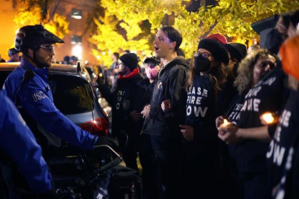 Members of U.S. Capitol Police forcefully removed protesters from the entrance to the Democratic Natio<em></em>nal Committee headquarters on Wednesday night. The protest was organized by IfNotNow, Jewish Voices for Peace Action and Democratic Socialists of America to call for a ceasefire in Gaza. 