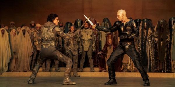 Timothée Chalamet as Paul Atreides & Austin Butler as Feyd-Rautha Harko<em></em>nnin in a blade fight in Dune: Part Two