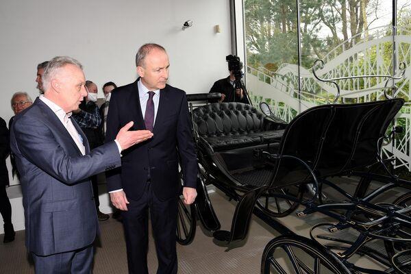 Carriage of sale: An Tánaiste, Micheál Martin, T.D. pictured with Mark Whitaker , CEO of JPMG Motor Group at the do<em></em>nation of  a carriage from the original Johnson & Perrott garage in Emmet Place, Cork with other artifacts to Cork Public Museum in Fitzgeralds Park. Picture: Adrian O'Herlihy