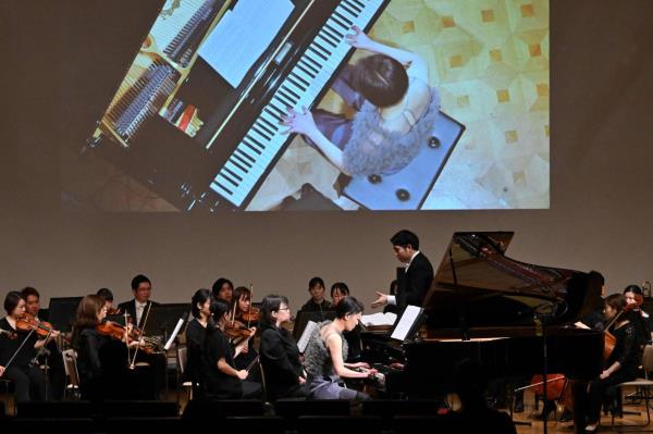 Higashino, who was born with three fingers on her right hand, o<em></em>nly began learning to play piano after the 'Anybody's Symphony No. 9' co<em></em>ncert programme was announced. Photo: AFP 