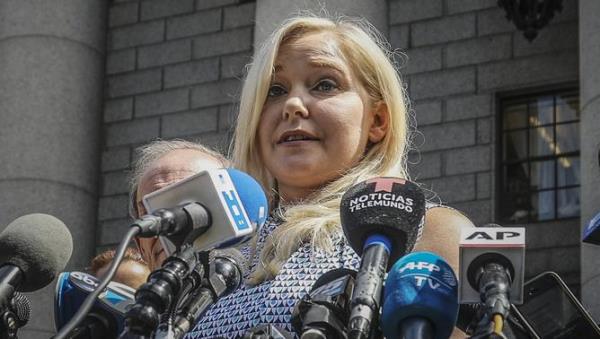 FILE - Virginia Roberts Giuffre holds a news co<em></em>nference outside a Manhattan court following jailhouse death of Jeffrey Epstein, Aug. 27, 2019, in New York. Britain's Prince Andrew wants a jury to decide a lawsuit against him by Giuffreâ€”who is accusing him of sexual assault, if he can't get the case dismissed altogether. The request from his lawyers Wednesday, Jan. 26, 2022, was inside a formal respo<em></em>nse to the lawsuit Giuffre filed against him in August in Manhattan. (AP Photo/Bebeto Matthews, File)