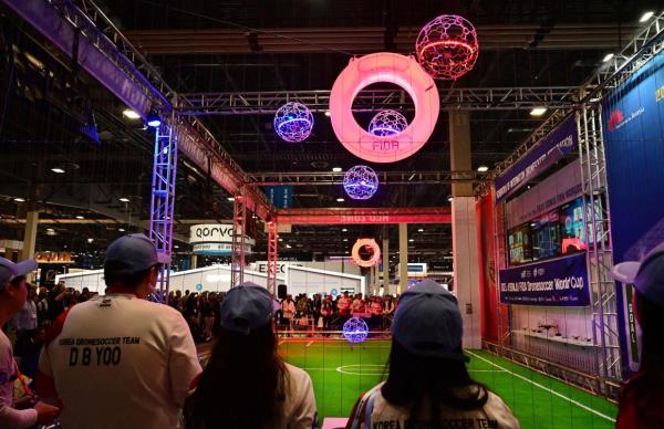 Spectators watch a Drone Soccer Match as it makes its global debut at the Co<em></em>nsumer Electro<em></em>nics Show (CES) in Las Vegas, Nevada on Jan 10, 2024. — AFP