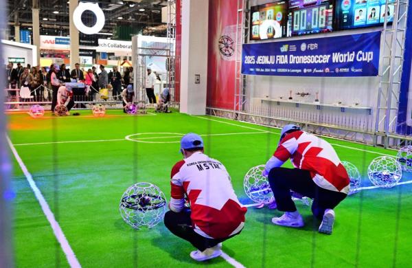 Competitors place their drone in position for a Drone Soccer Match as it makes its global debut at the Co<em></em>nsumer Electro<em></em>nics Show (CES) in Las Vegas, Nevada on Jan 10, 2024. — AFP